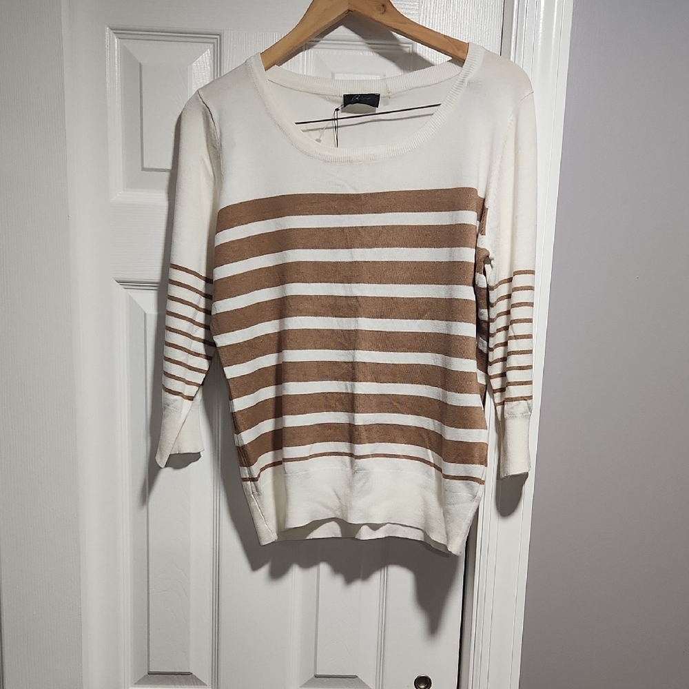Brand new top.Small stain please look at last photo closely not too noticeable.
